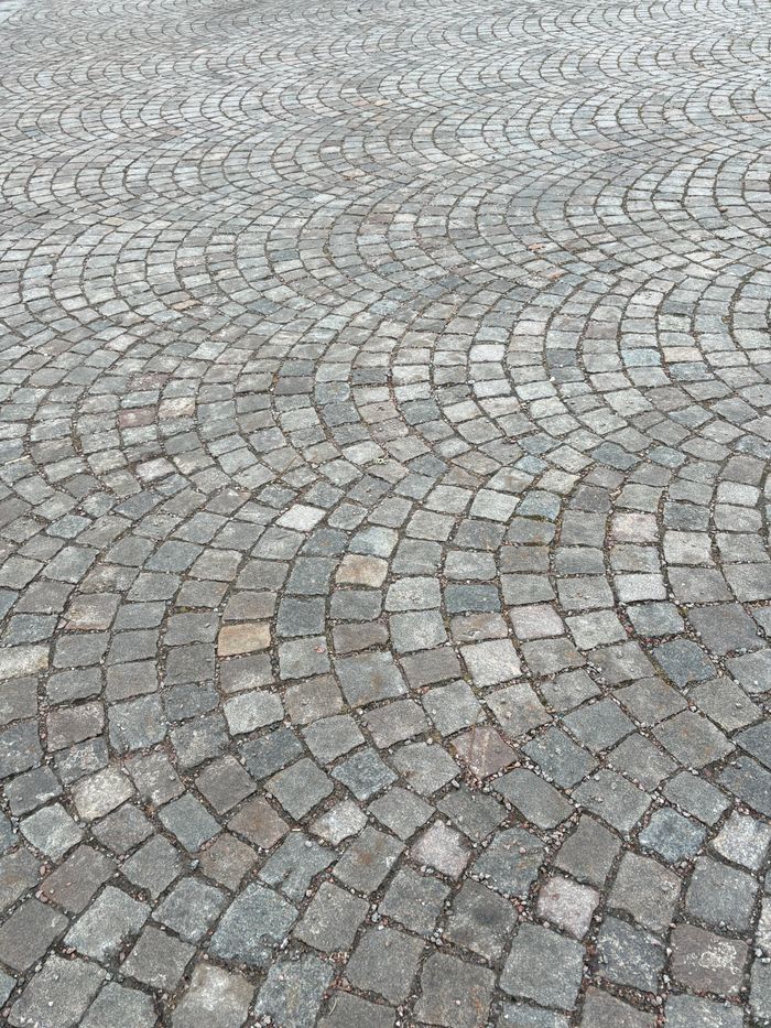 About Detailed view of geometric cobblestone patterns in Linköping, Sweden.
